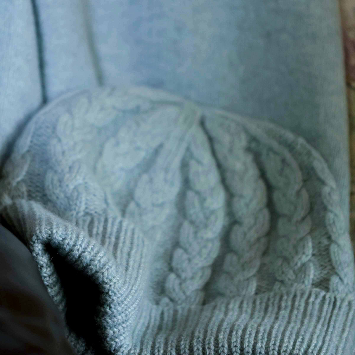 William Lockie Cashmere Hat in Silver and Blue — worn with a matching cashmere scarf in a cable-knit pattern; complete look in silver and blue
